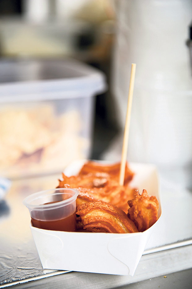 Nibble on their signature churros with a choice of caramel or chocolate sauce