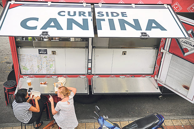 The truck has heavy duty metal flaps on the side that can be used as tables