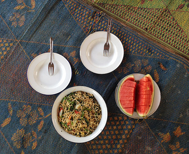 A fuss-free lunch of stir-fried noodles and watermelon, prepared by Karen women.