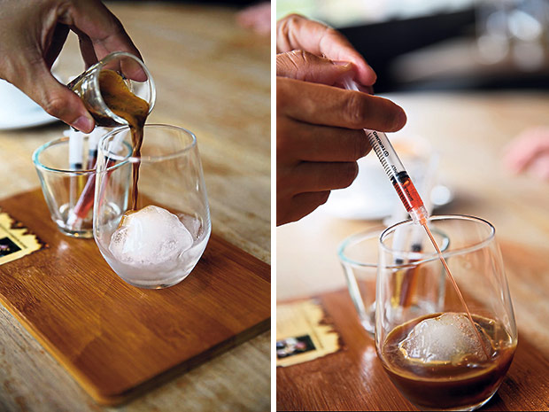 Step 1: Pour the shot of espresso onto an ice-cube made from Evian water (left). Step 2: Add the green apple and strawberry syrup for acidity and complexity (right)