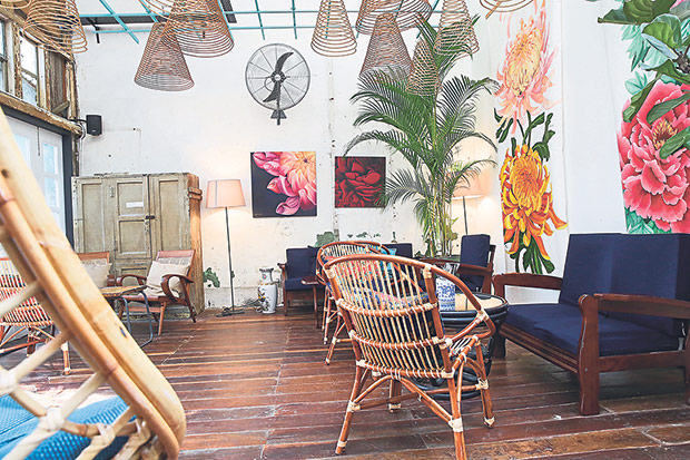 The “rainbow room” is dominated by two large paintings of flowers — chrysanthemums and peonies.