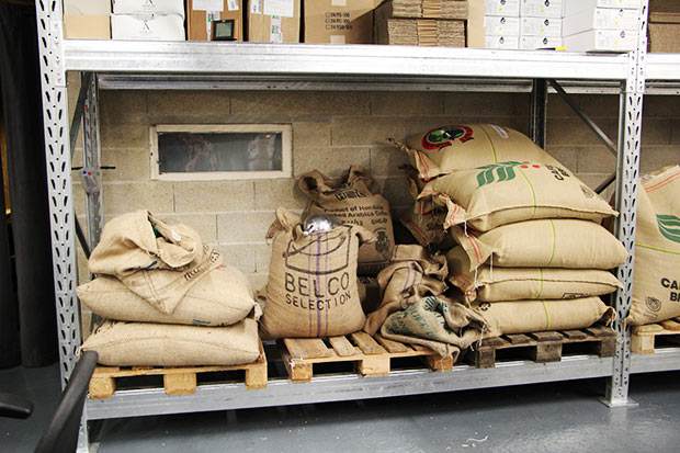 Bags of green beans in the roastery behind Café Lomi.