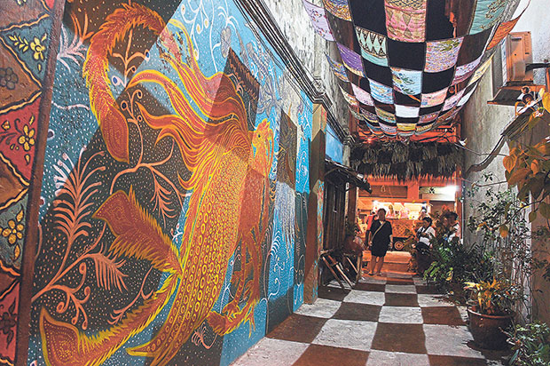 At night, the strung up batik pieces create a checkerboard effect.