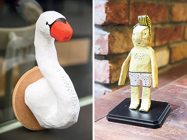 Sukka Project makes all kinds of papier-mâché such as this swan head (left). Check out this Hassan figurine who is ready to go surfing! (right).