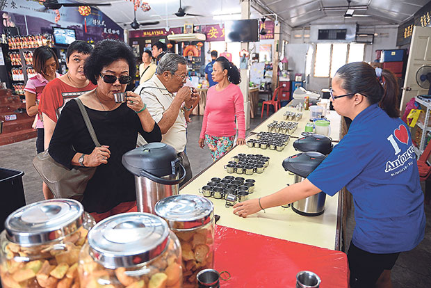 Visitors sampling the coffee available at Antong Coffee.