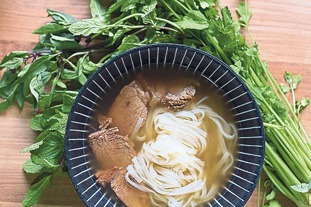 A “virgin” bowl of pho (beef, noodles and broth) before garnishing.