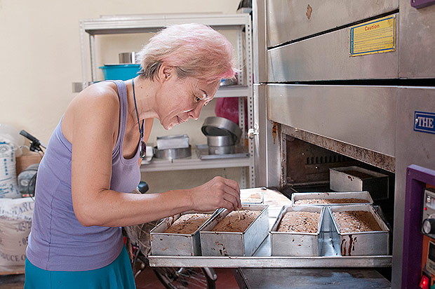 Nely preparing her cakes in the kitchen.