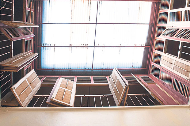 The air well in the middle of the prewar shophouse gives the cafe ample natural light.