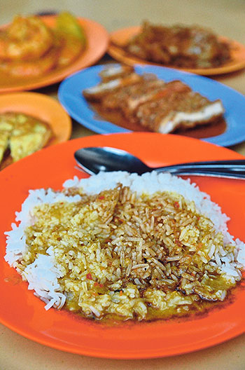 The proof of the mettle lies in the curry-drenched rice; at Loo Hainanese Curry Rice stall, the combination of curries and braised gravy make it a lip-smacking experience on its own