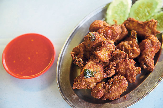 It is hard to stop at just one piece of pandan chicken with its aromatic marinade.