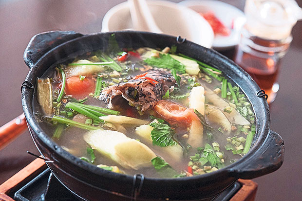 Vietnamese special snakehead fish soup with sweet pickles.