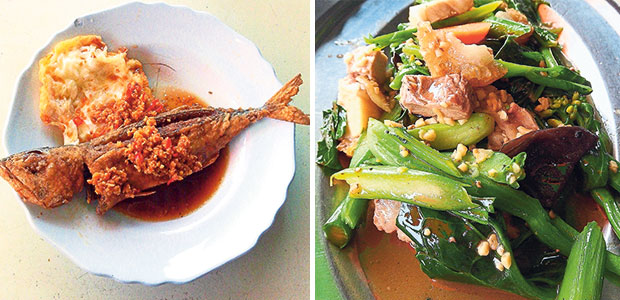 The stall under the big tree does an excellent fried kembung fish topped with finely minced fried garlic and chopped chillies (left). Get your greens with the fried kailan and siew yoke at the stall under the big tree (right).