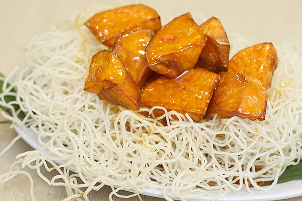 It’s hard to believe that this simple dessert of sweet potato cubes coated with syrup is so much fun.