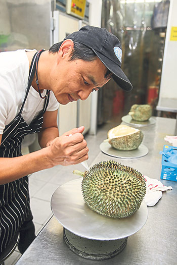 Matthew Yap with his thorny creation that takes many hours to make from scratch.