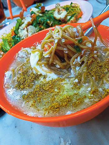 Hoong Tho Meen is their signature noodles; yee mee in a soup infused with sweetness from the pork and shrimp, then scattered with a handful of cuttlefish powder
