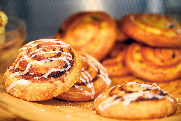 Customers often drive by to do quick pick-ups for items like this cinnamon danish or even hot cross buns for a snack.