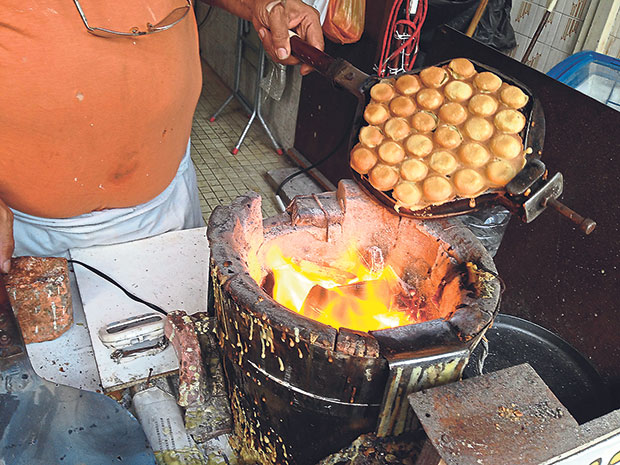 Egg waffles baked freshly upon order over a charcoal fire