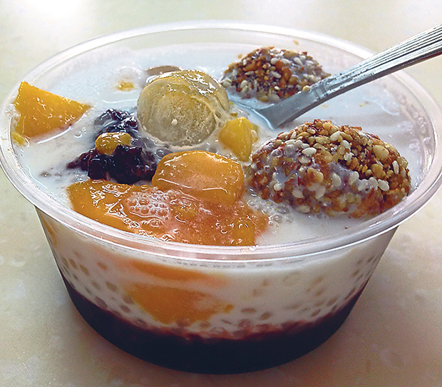A refreshing mix of black glutinous rice, fresh mangoes, coconut milk, mango dumpling and mochi ice-cream balls