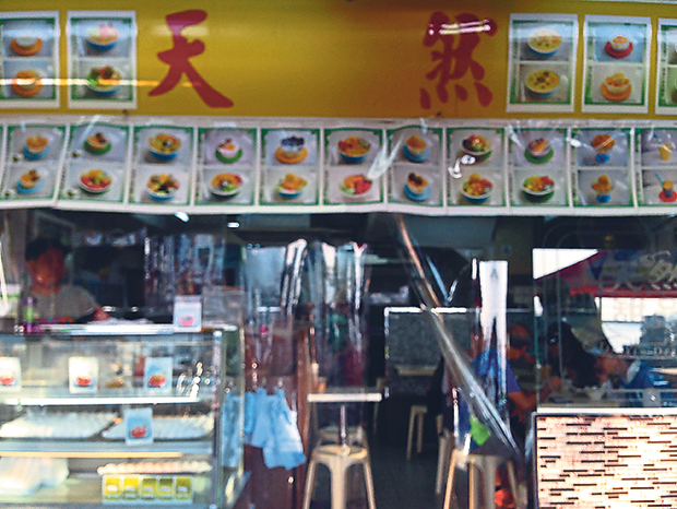 Tin Yin Desserts’ menu is plastered across its facade