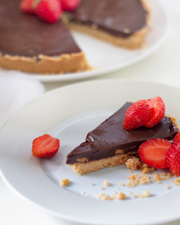 Serve each slice of chocolate tart with some fresh strawberries
