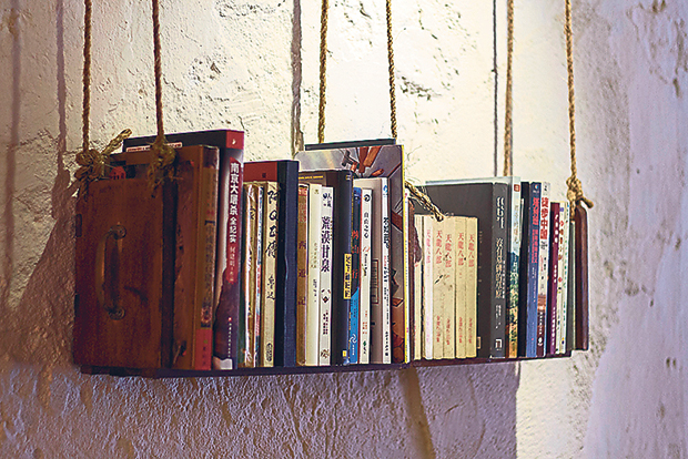 Well-read books on a hanging shelf