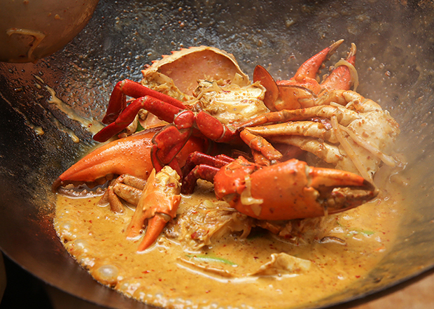 The crabs are cooked in a creamy fragrant kam heong sauce