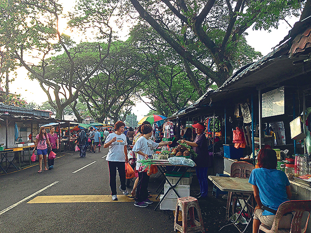 Shop, have breakfast and catch up on neighbourhood news at this market under the trees at Pasar Desa Setapak