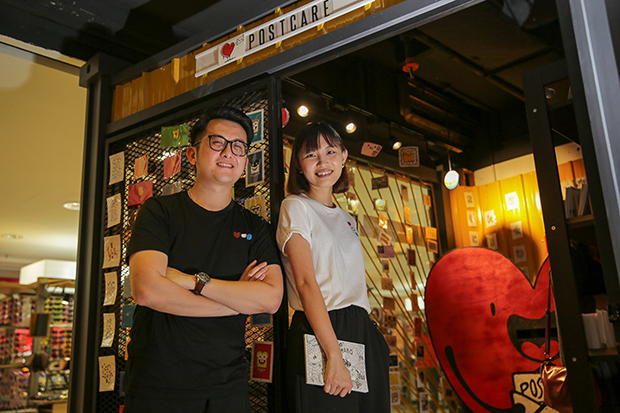 Kay Ho and Will Sii at the first of its kind postcard station in Malaysia