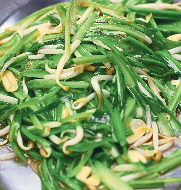Order vegetables like this fried dragon leaves with bean sprouts at Cai Ji