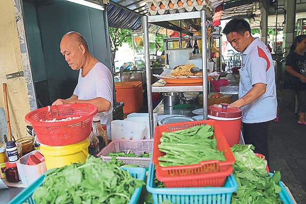 Foon Xiang’s father-and-son team Tan Tuck Foon (left) and Tan Weng Fai (right) once worked in Singapore