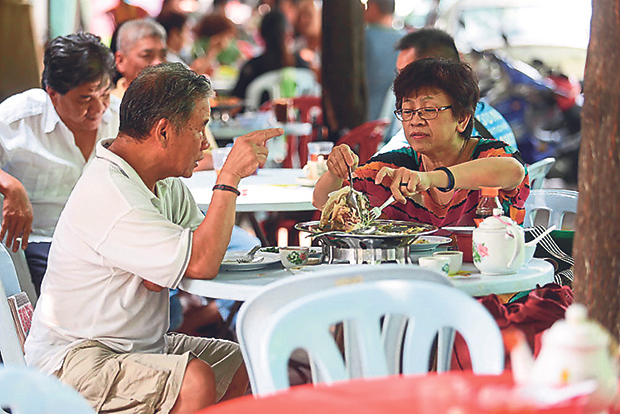 Try to score for a table under the shade of the trees at Foon Xiang