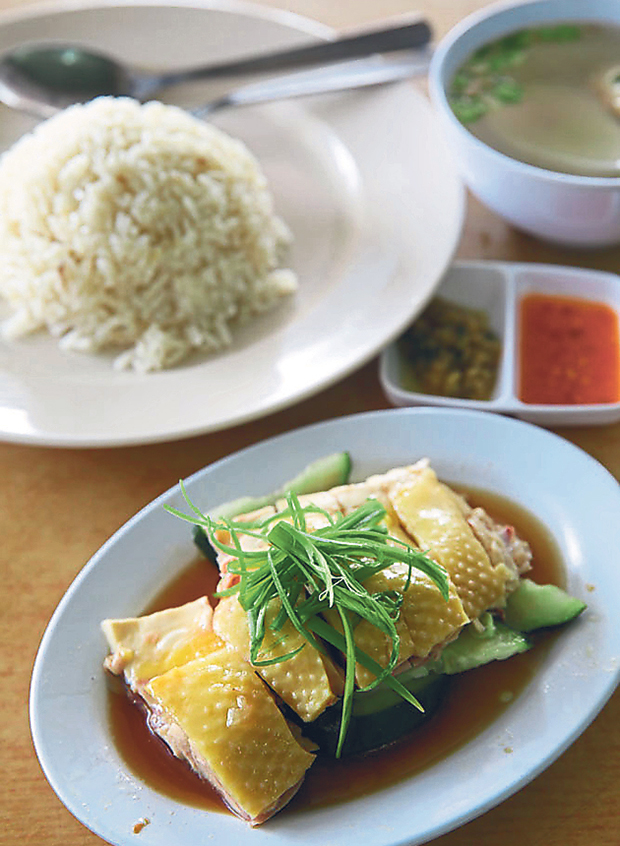 The draw for Restoran dan Kedai Kopi La is the aromatic chicken rice paired with yellow skin poached chicken, homemade soup and a delicious ginger spring onion dip