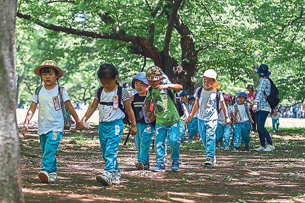 Children in their school or kindergarten uniforms at Yoyogi Park