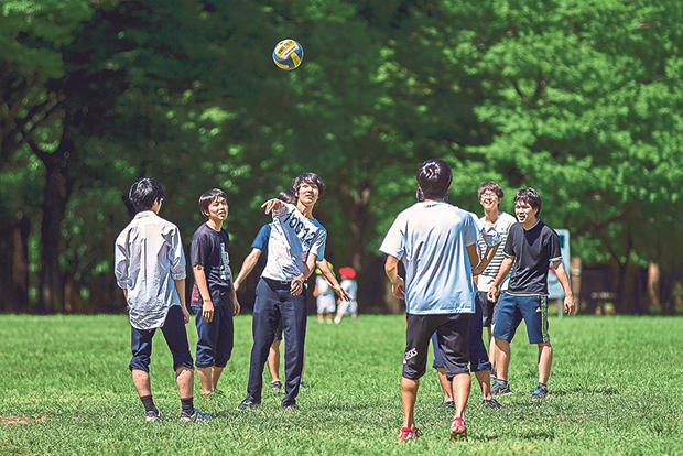 Japanese boys play ball at Yoyogi Park