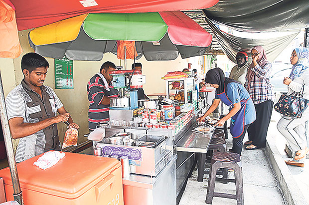You can also sit in front of the stall to watch the shaved ice action.