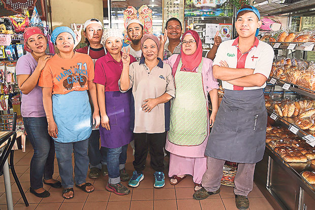 The team behind Cherry Cake House (from left to right): Titi, Nani, Ah Meng, Eunice Mah, Agus, Halimah, Steven, Rumuni and Ah Yin.