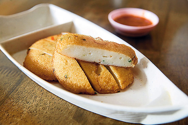 As you wait for your noodles to cook, nibble on the fried fish cake with their tangy chilli sauce.