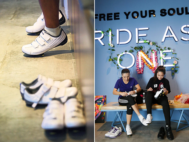The shoes are designed with cleats that clip onto the pedals and help riders position themselves correctly (left). Riders getting ready for class; the garlands were part of the decor for the Tomorrowland theme (right).