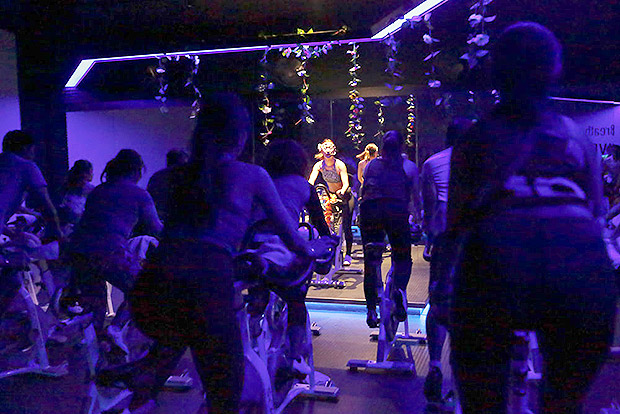 In the darkened studio, the LED lights and pulsating music creates an energetic vibe that's meant to motivate.