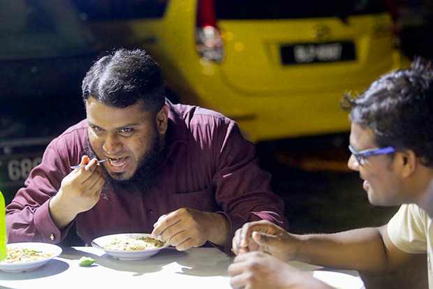 Hyderabadi native Mohammed Shamsher Ali enjoying the taste of the haleem.