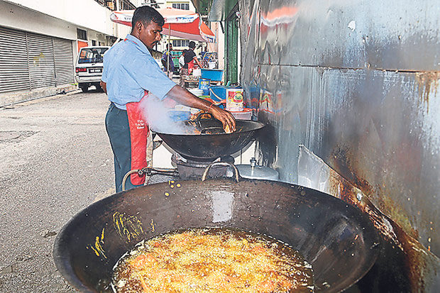 From 10am onwards, they start frying the fish and chicken for lunch.