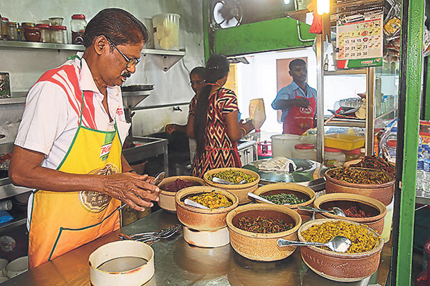 The claypots are elevated at the back row so customers can easily reach for their vegetables.