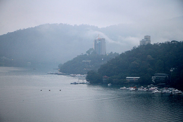 View of the tour boats of Sun Moon Lake from the Wenwu Steps.