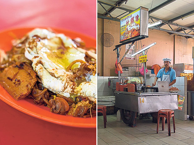 Besides cockles and a sunny side-up egg, every plate of this char kway teow comes with two pieces of otak-otak (left). The stall selling char kway teow with otak-otak (right).