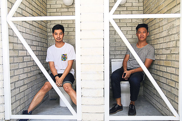 E. and Ong showcasing the functional and robust toilets — don’t worry, it’s still a work-in-progress and there will be actual doors! .