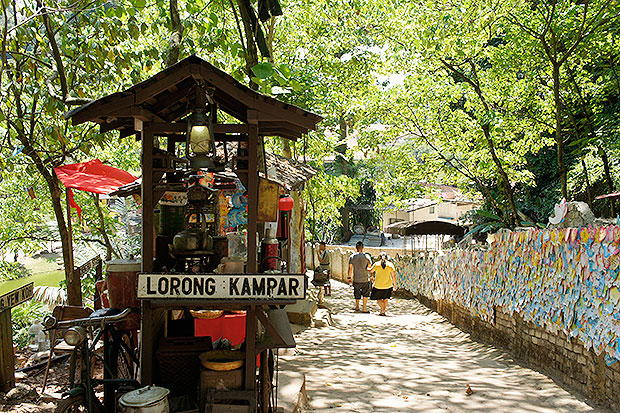 Facing this replica beverage stall is a wall of wishing cards.