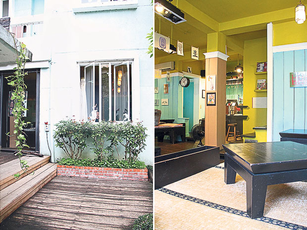 Who Together Café is nearly hidden by the trees in its garden (left). Vibrant illustrations adorn the walls of Who Together Café (right).