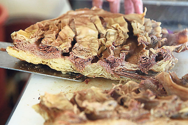 Albert cooks the beef brisket till the meat is fork tender and the fat is coagulated into a creamy mass.
