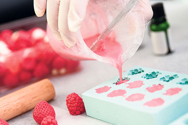 The making of raspberry-shaped soap.