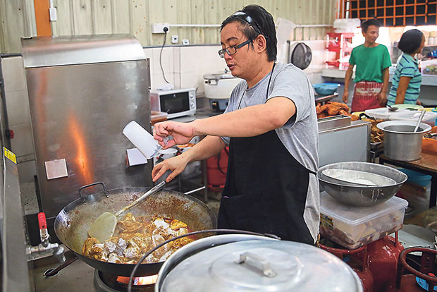 The busy kitchen at the back of the kopitiam.